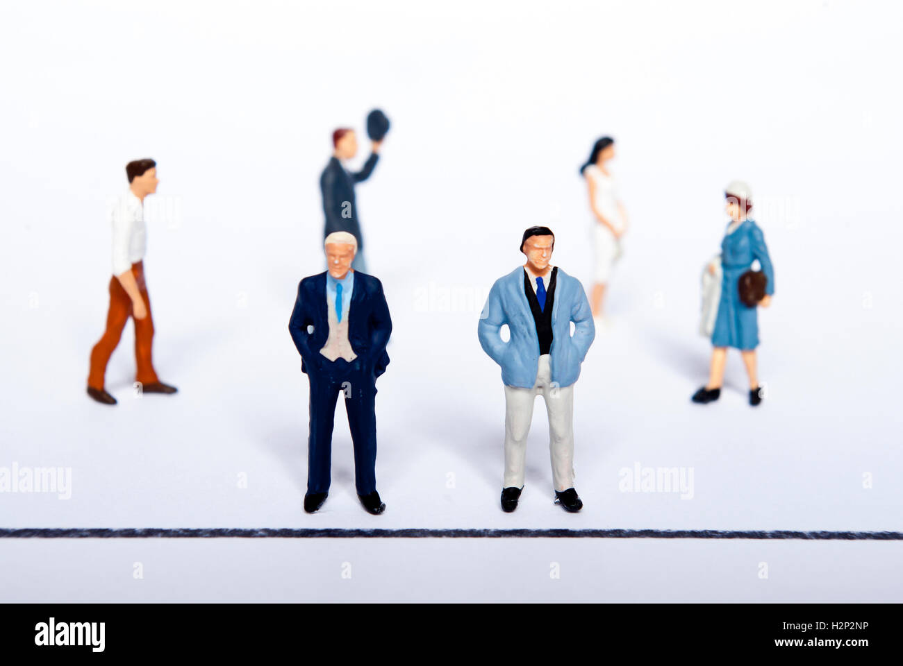 miniature people on line Stock Photo - Alamy