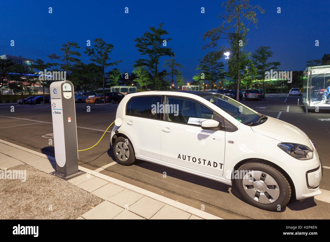 Electric car Volkswagen eUP! at a charge column in Autostadt Wolfsburg, Germany Stock Photo