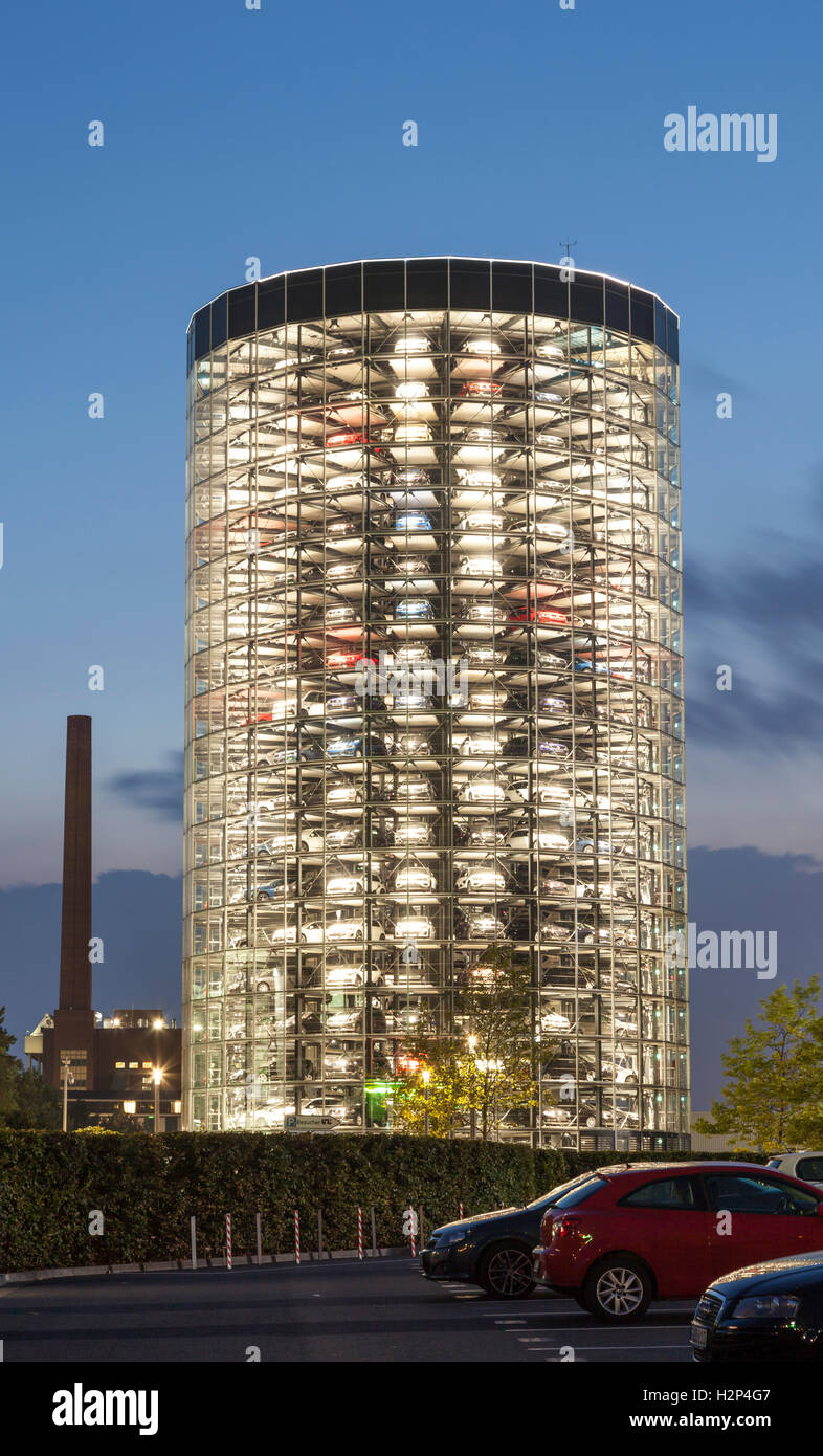 Storage building for new Volkswagen cars in Autostadt illuminated at night Stock Photo