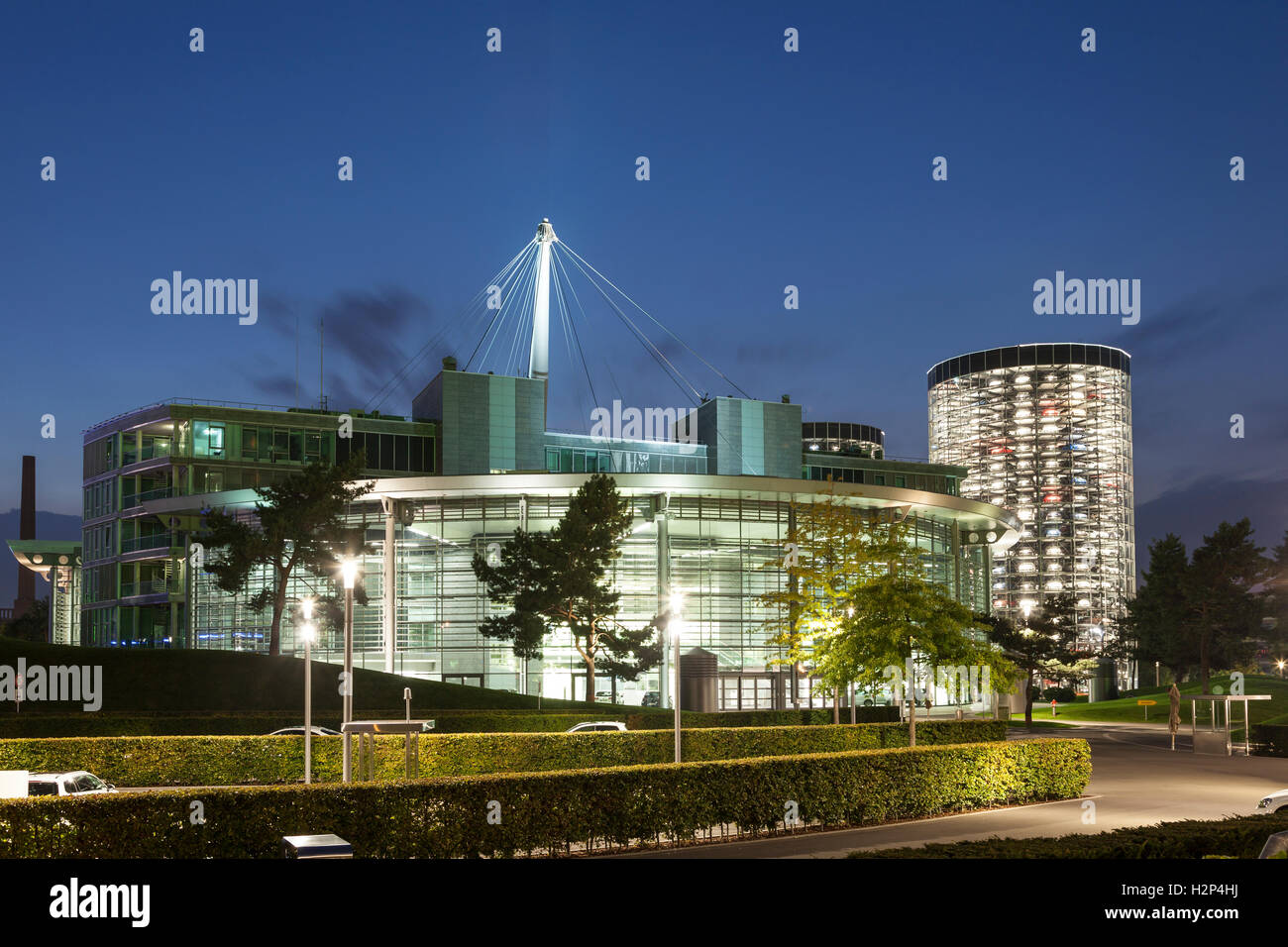 Contemporary buildings at the Volkswagen Autostadt illuminated at night. Wolfsburg, Germany Stock Photo