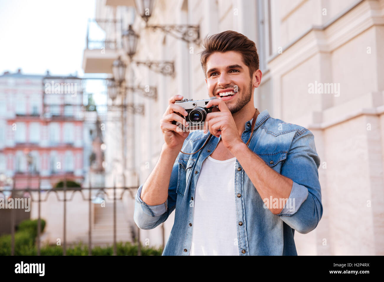 Take man. Мужик фоткающий на телефон на улице фото. Человек фотографирует журнал. Man taking photo cellphone. Человек фоткает коробку.