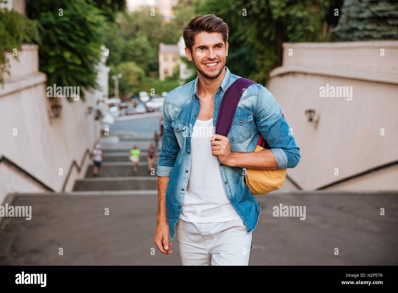 Man backpack walk away hi-res stock photography and images - Alamy