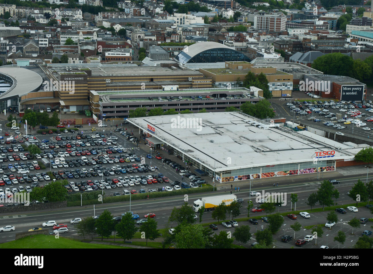 Shoppers cars parked outside a Tesco supermarket, the UK's biggest supermarket chain, in Swansea