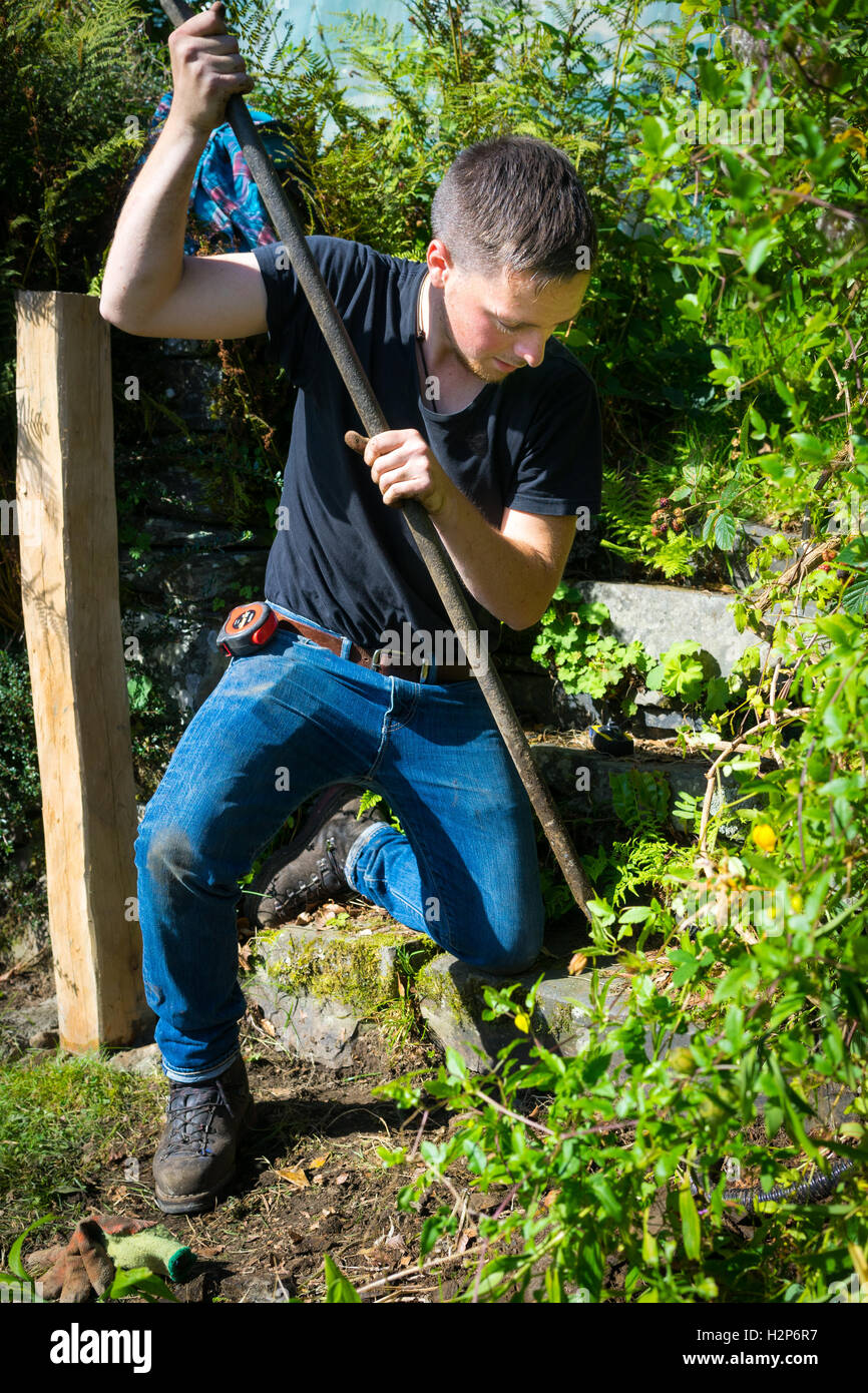 Making a hole for gate post Stock Photo Alamy