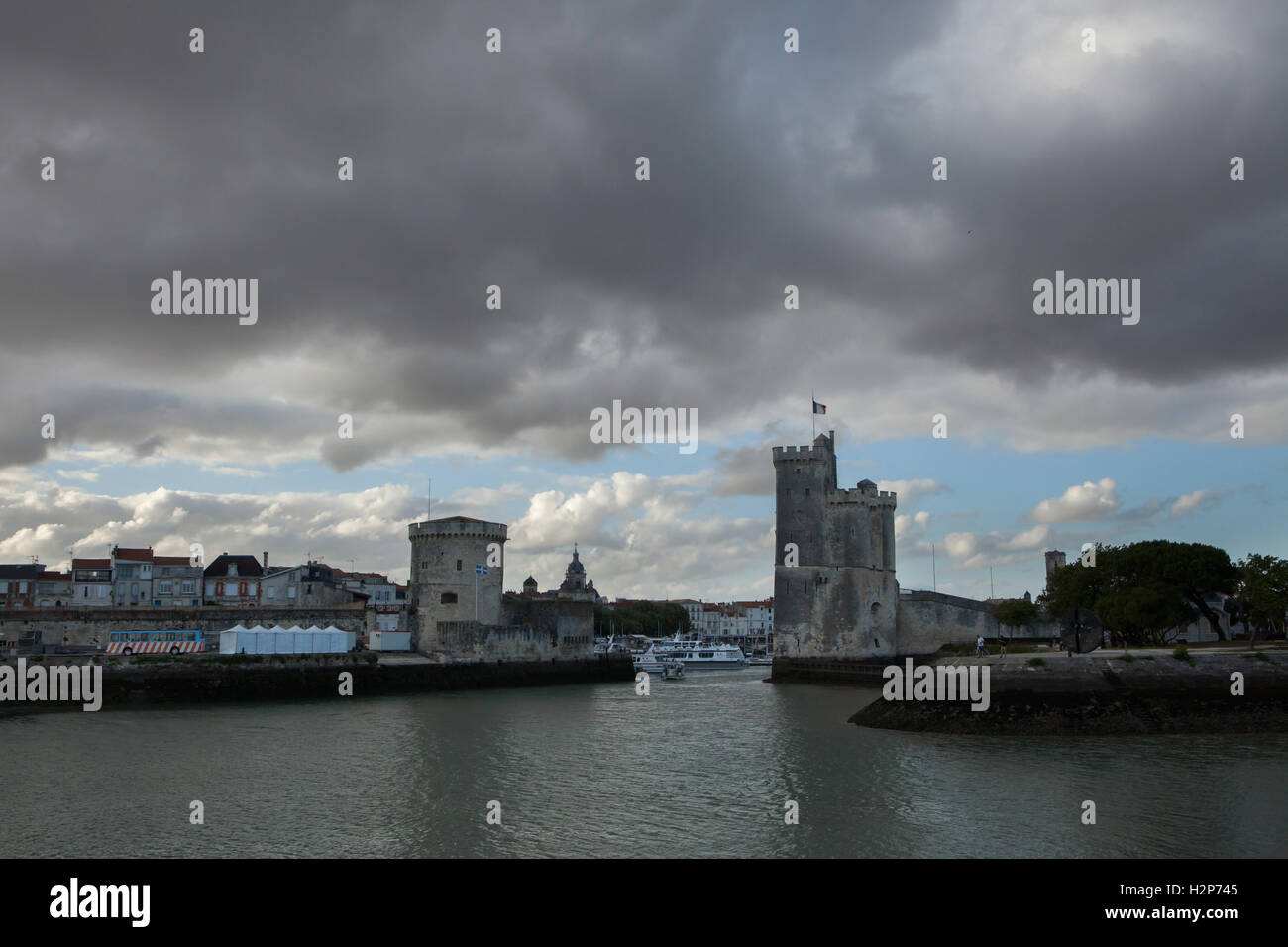 Tour Saint-Nicolas (R) and Tour de la Chaine (L) in the Old Harbour (Vieux Port) in La Rochelle, France. Stock Photo
