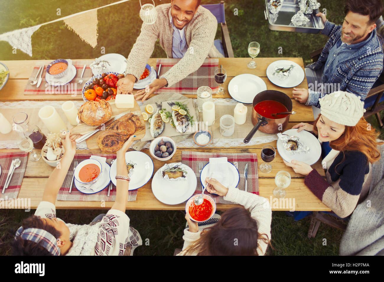 Friends enjoying lunch at patio table Stock Photo Alamy