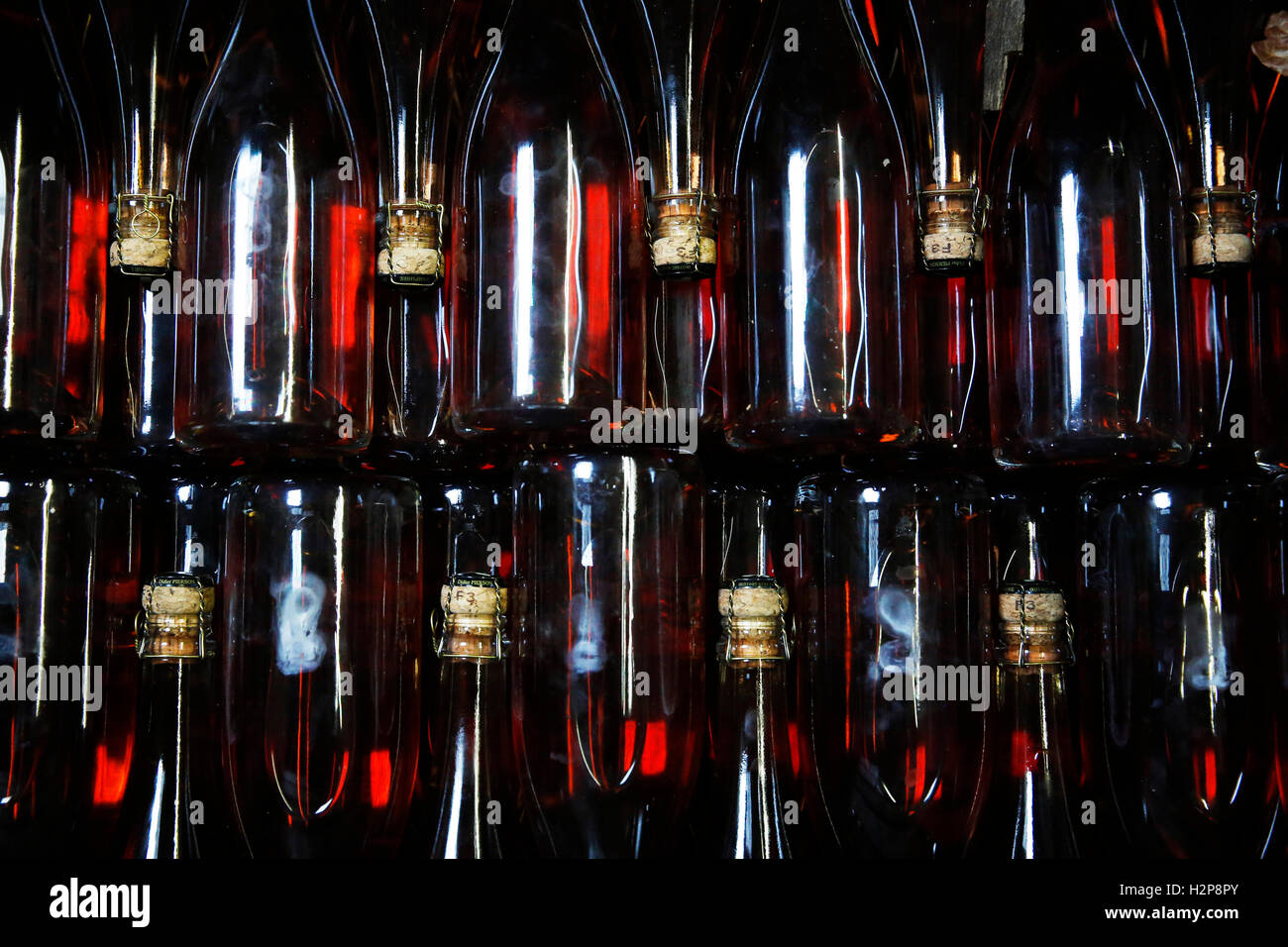 Bottles of sparkling Rose wait to be labeled at the winery of Hambledon Vineyard situated on the South Downs near Waterlooville Stock Photo