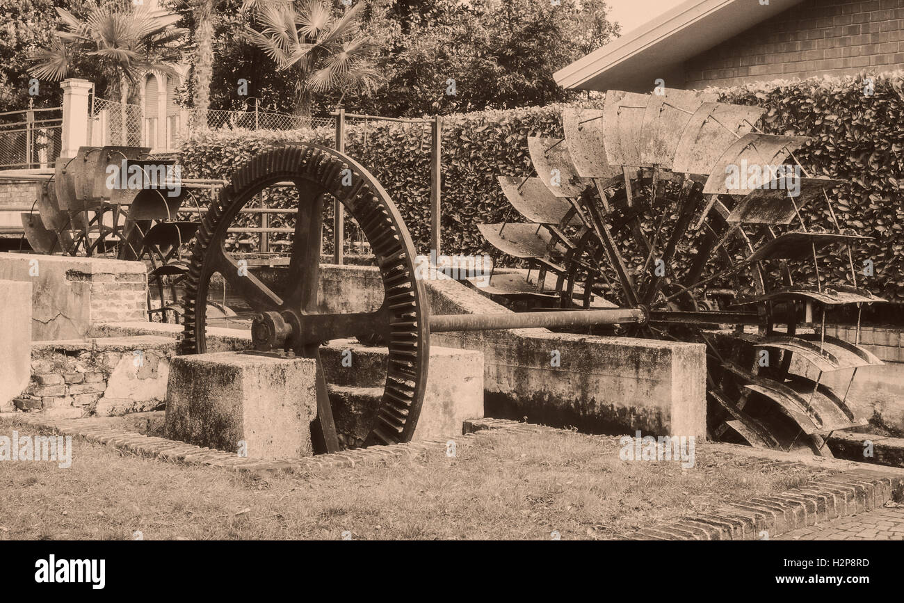 Old wheels of a watermill. Vintage style picture. Adding grain to give an old photo effect. Stock Photo