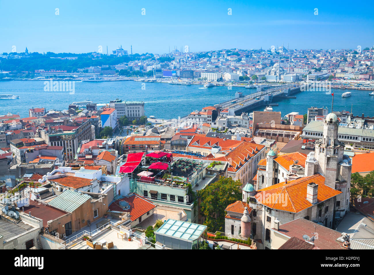 Istanbul, Turkey. Summer cityscape with bridge over Golden Horn a major urban waterway and the primary inlet of the Bosphorus Stock Photo