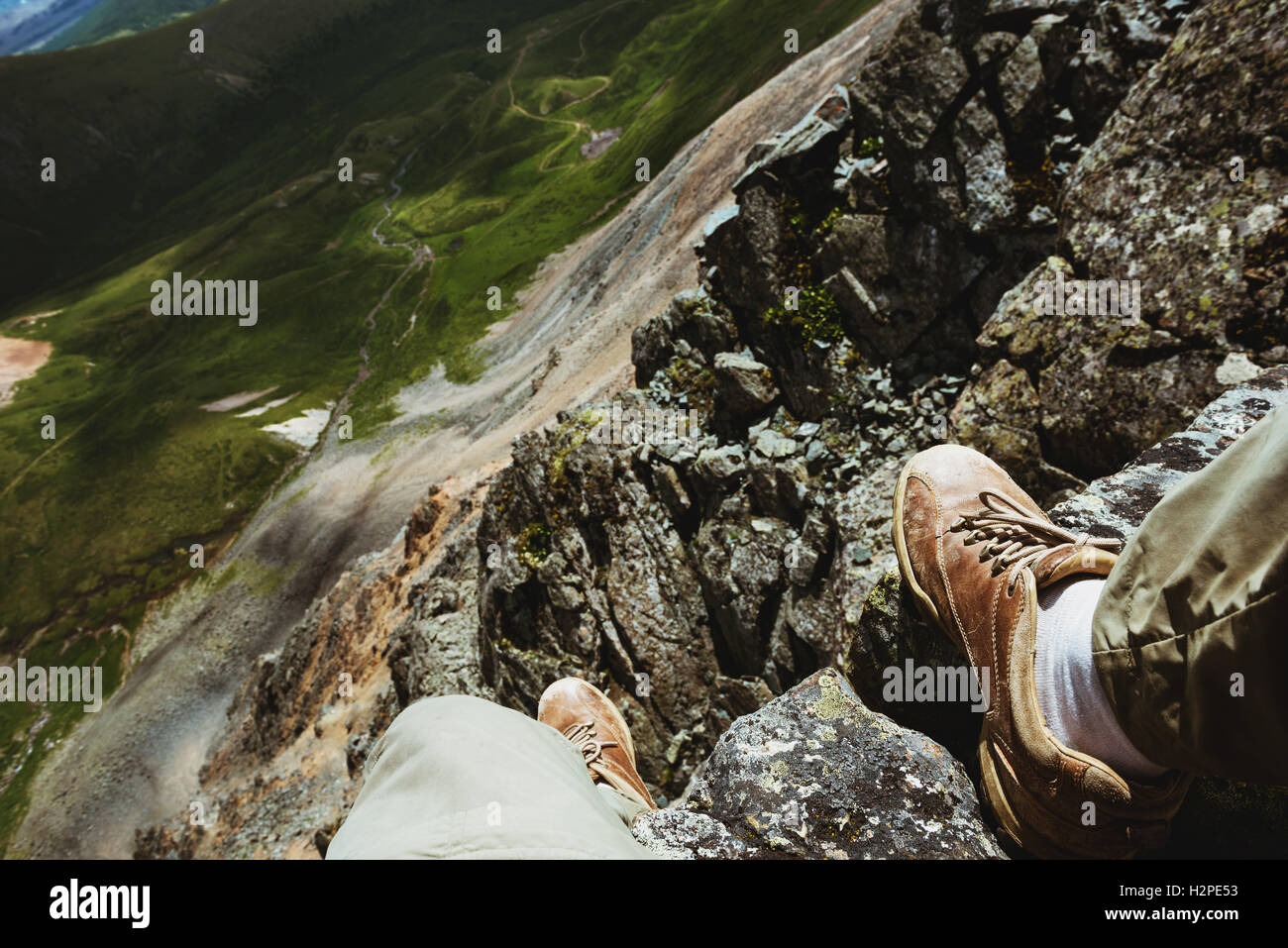 Man foots on a mountains background Stock Photo