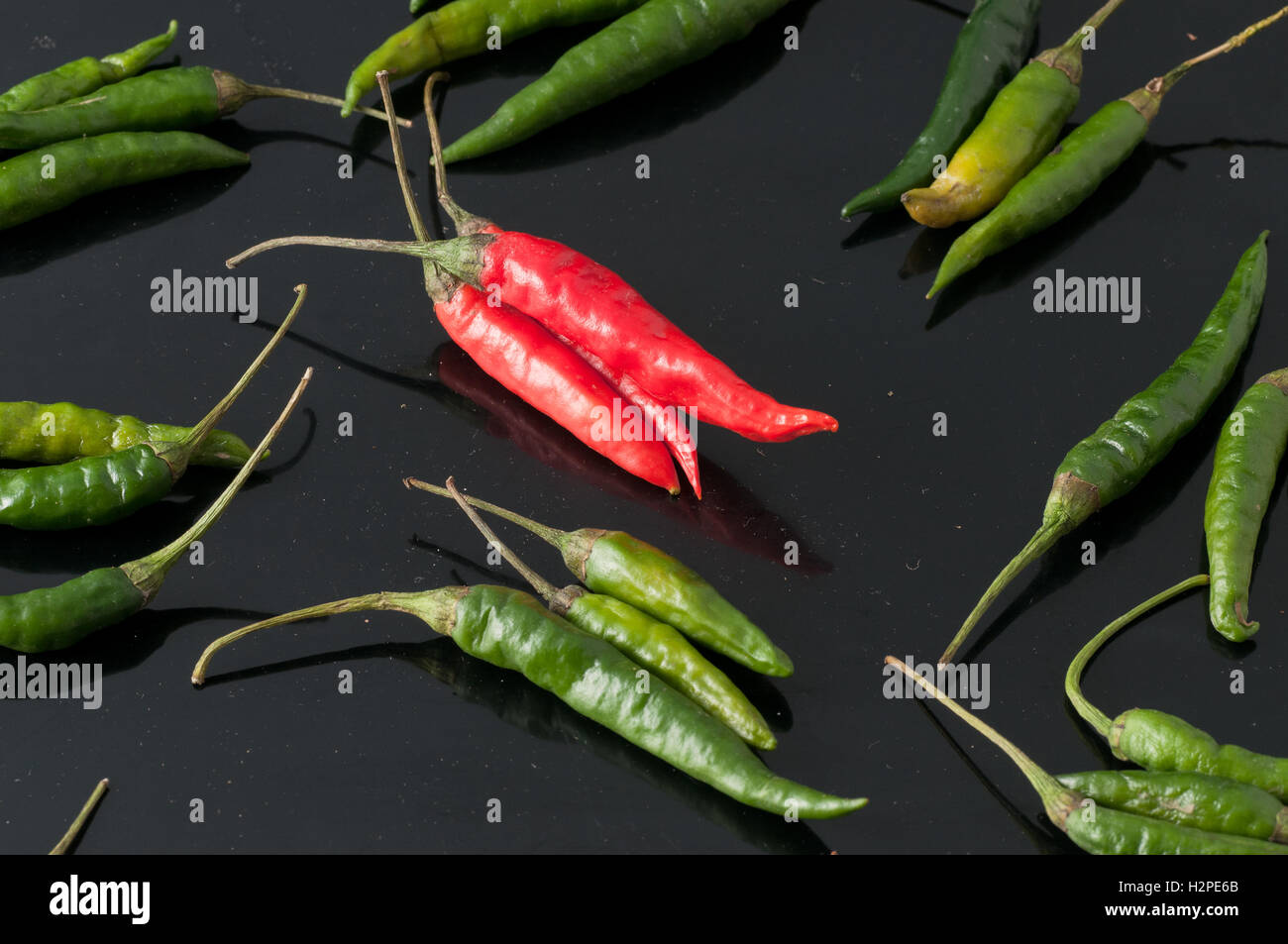 green chili peppers and red Stock Photo - Alamy