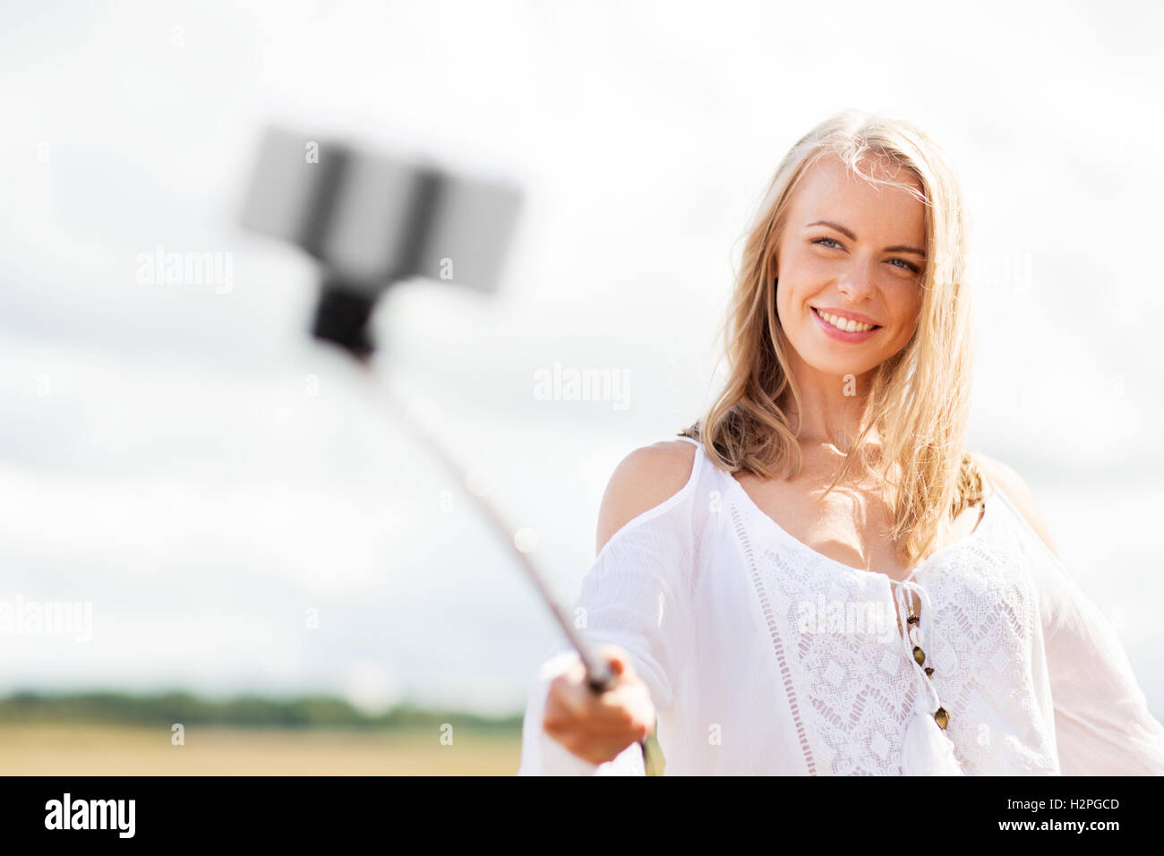 happy young woman taking selfie by smartphone Stock Photo - Alamy