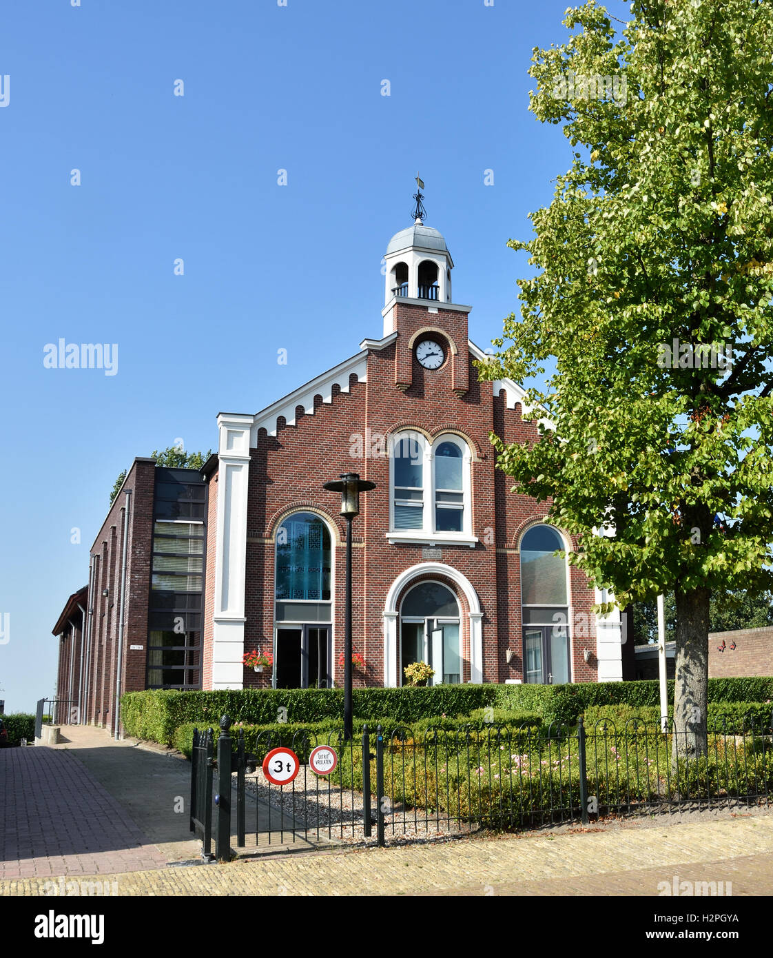 Workum Friesland Netherlands old church ( Gereformeerde Kerk 1887-2005 ) rebuild as apartment house Stock Photo