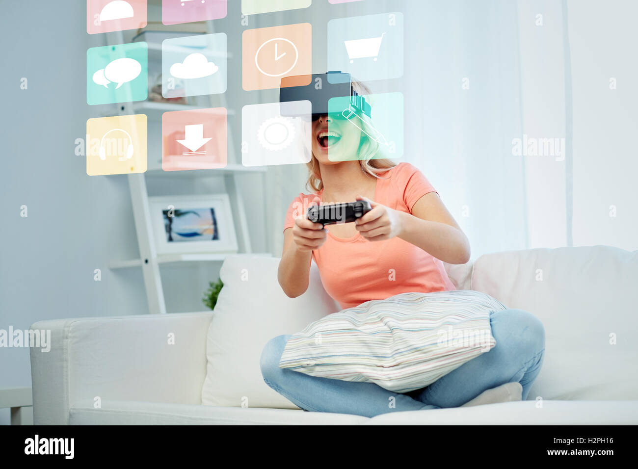 woman in virtual reality headset with controller Stock Photo - Alamy