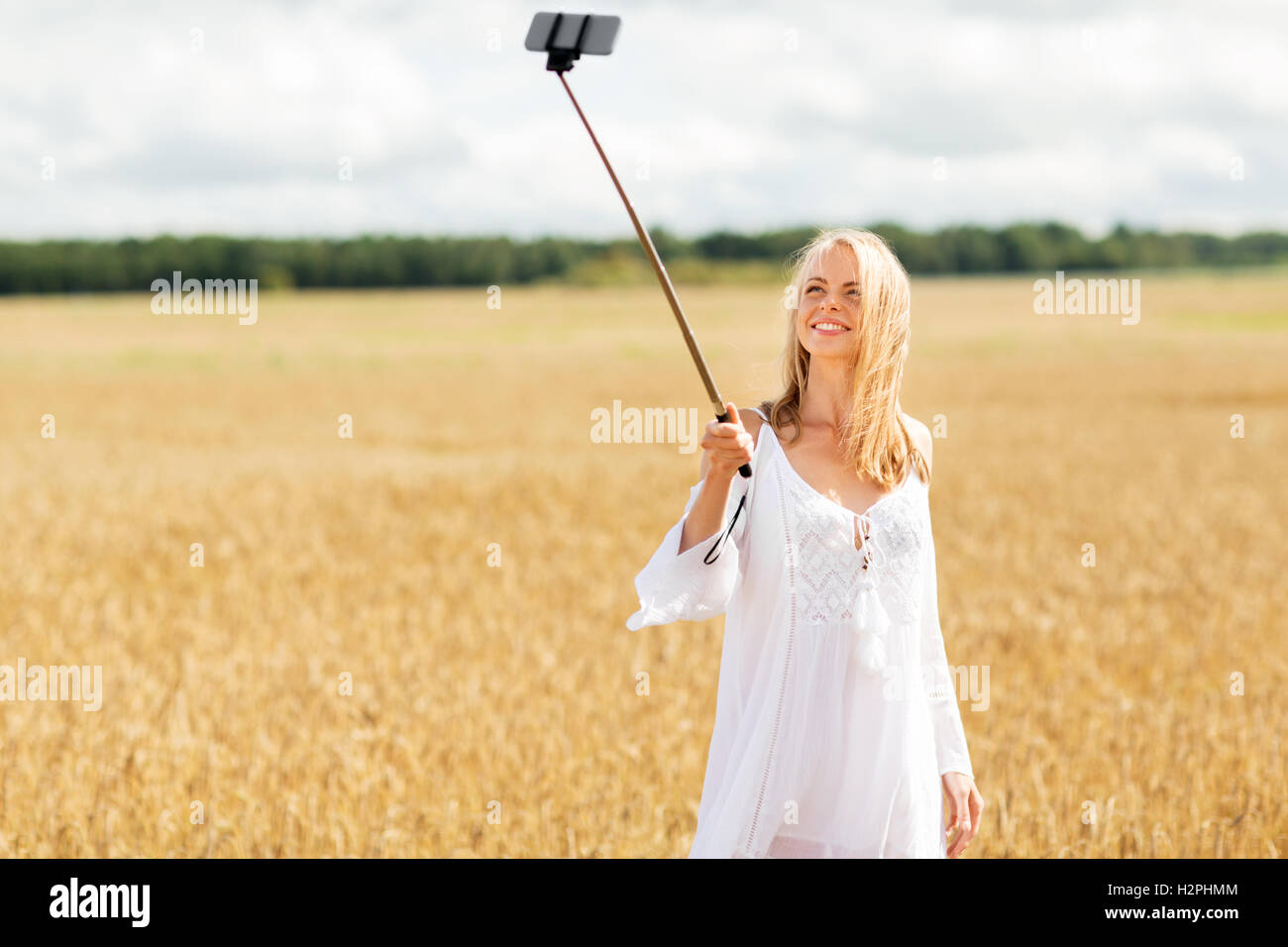 happy young woman taking selfie by smartphone Stock Photo - Alamy