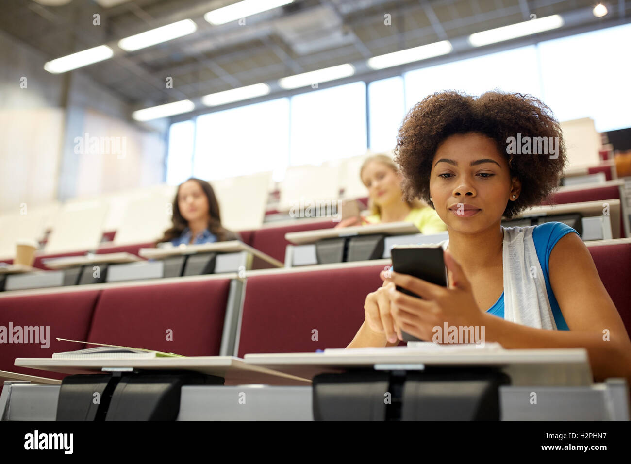 african student girl with smartphone at lecture Stock Photo - Alamy