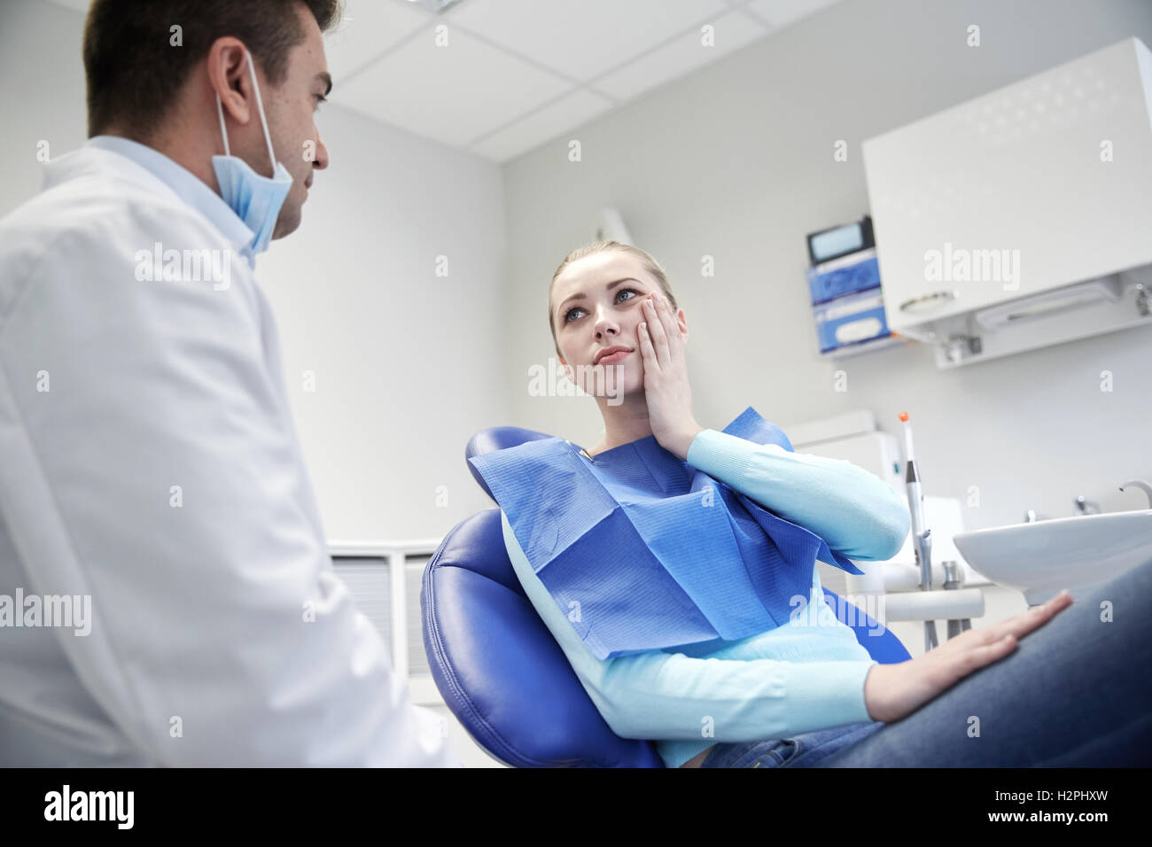 male dentist with woman patient at clinic Stock Photo Alamy