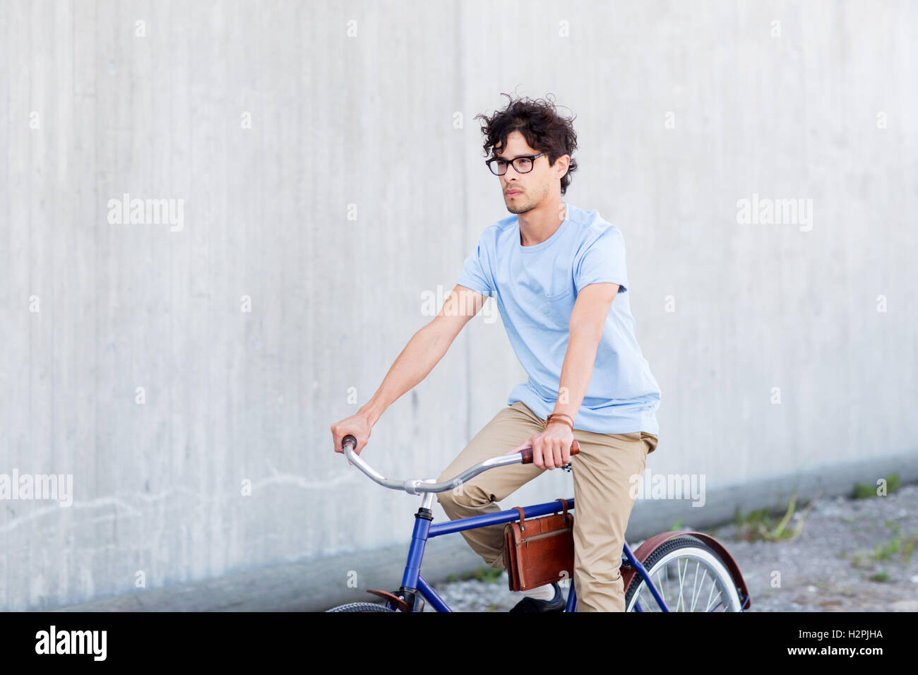 young hipster man riding fixed gear bike Stock Photo Alamy