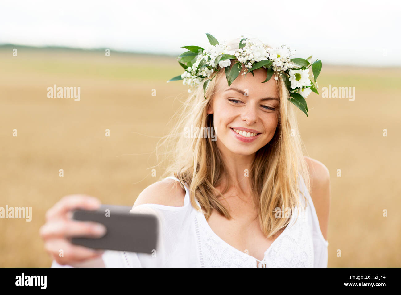 happy young woman taking selfie by smartphone Stock Photo - Alamy