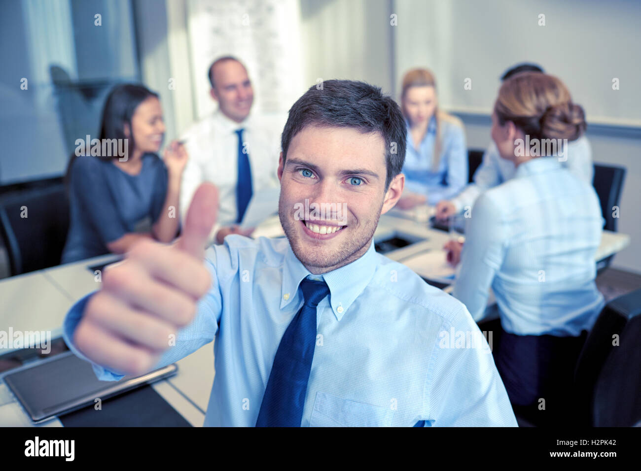 group of smiling businesspeople meeting in office Stock Photo - Alamy