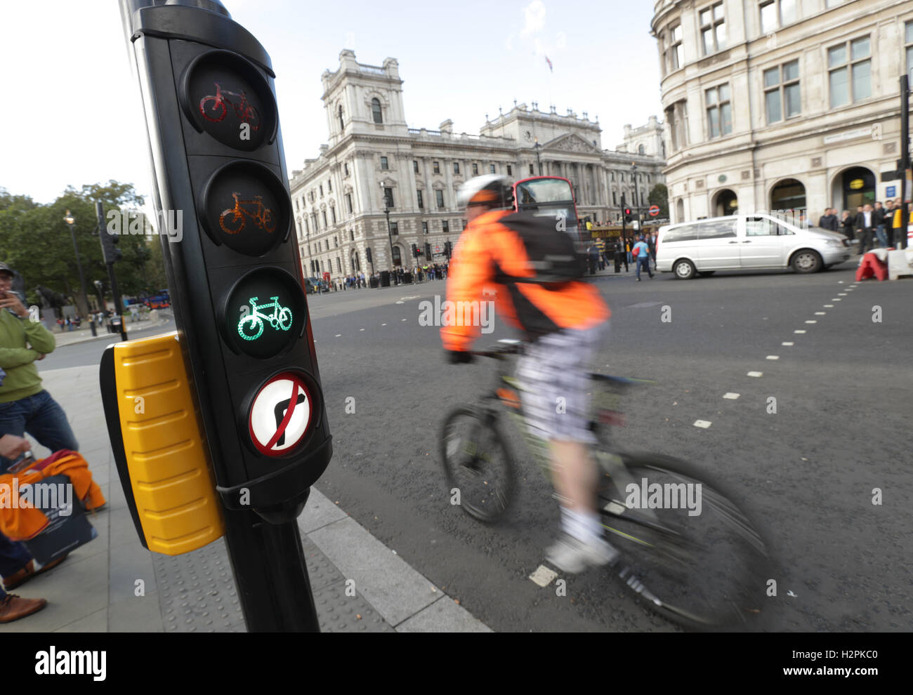 A cyclist in Parliament Square, Westminster, London. Thousands of lorries could be banned from London under plans to make the capital's roads safer for cyclists. Stock Photo