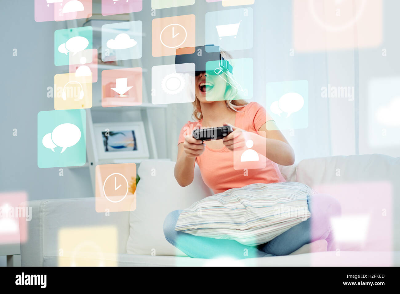 woman in virtual reality headset with controller Stock Photo - Alamy