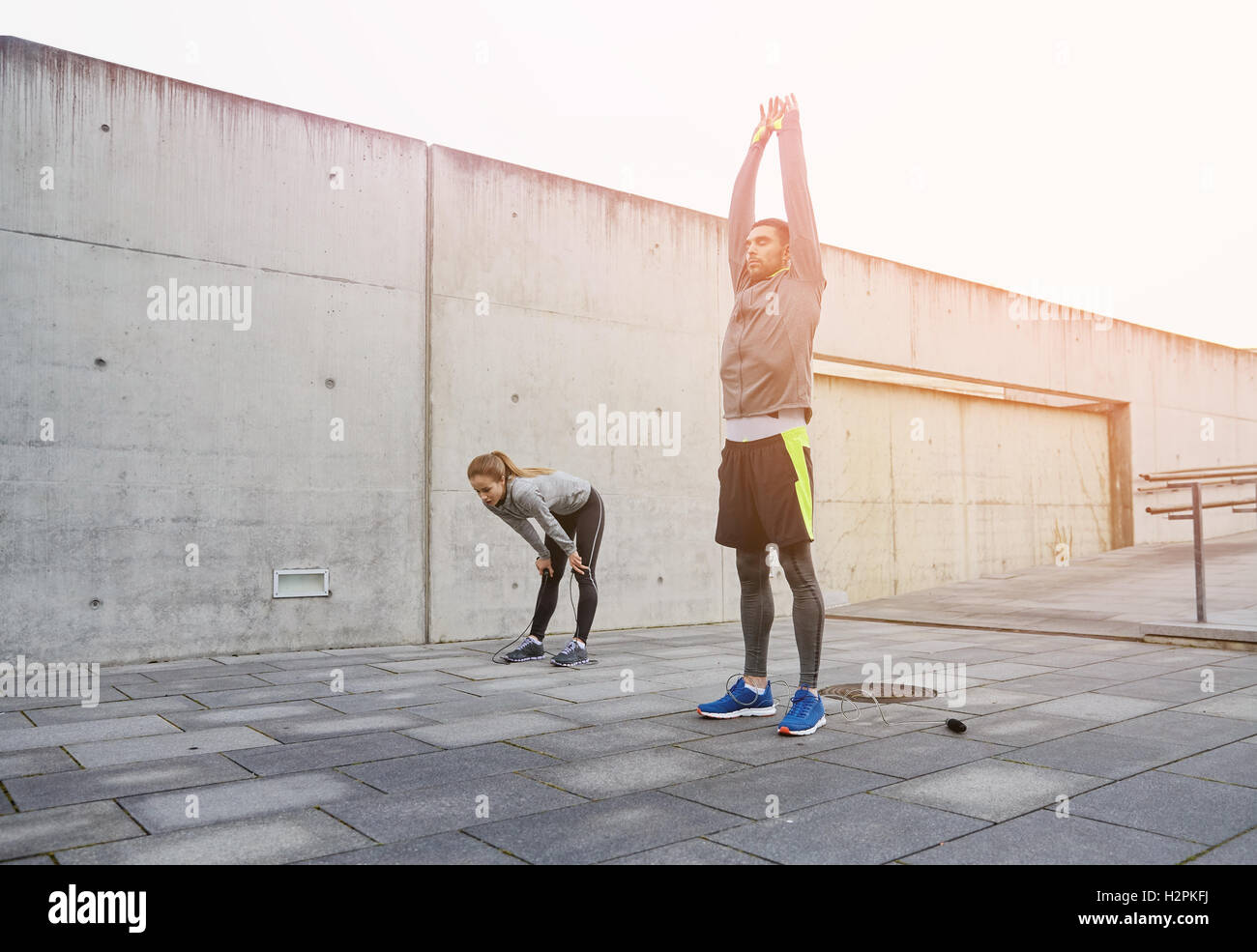 tired couple stretching after exercise Stock Photo Alamy