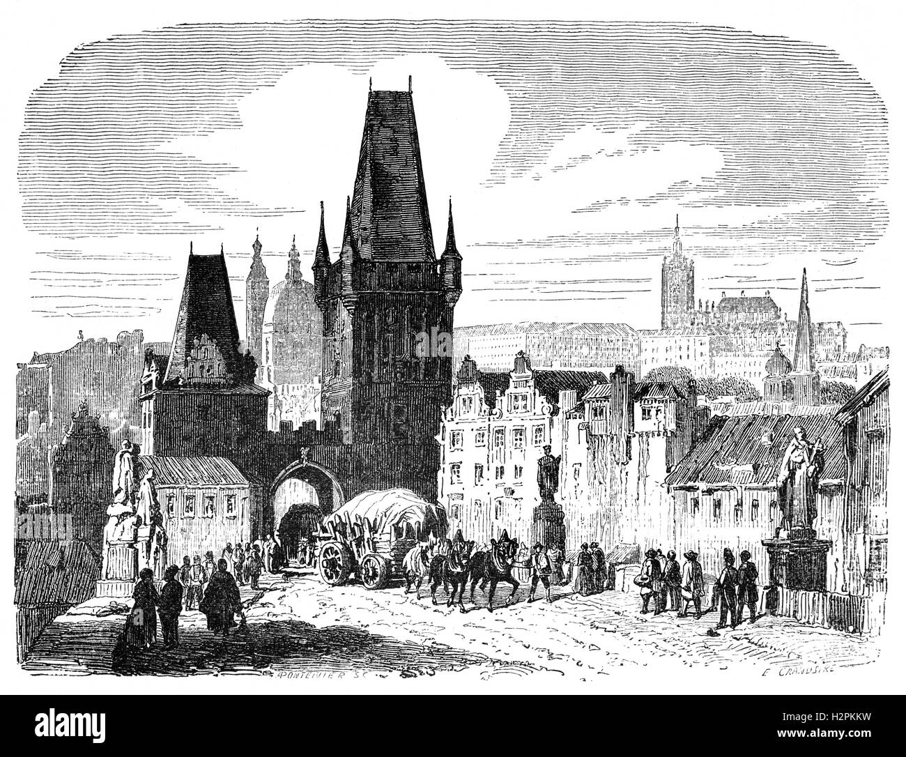 19th Century view of one of the bridge towers of the Charles Bridge in over the Vltava River in  Prague, the capital and largest city of the Czech Republic. Stock Photo