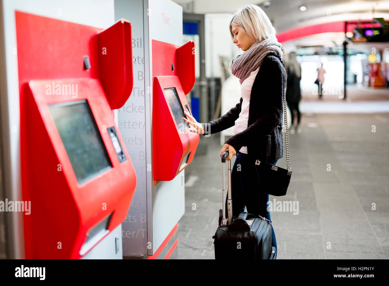 Woman Buying Train Ticket Using Vending Machine At Station Stock Photo ...
