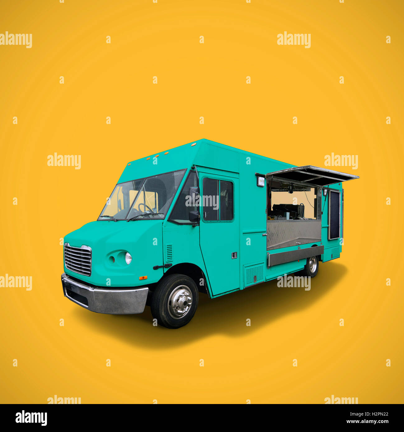 blue fast food truck on warm yellow background, template with copy space, clipping path Stock Photo