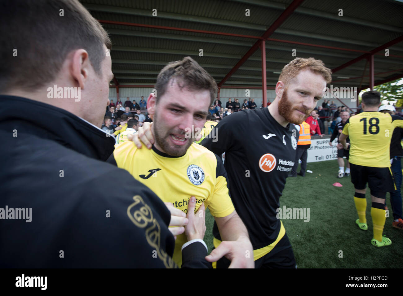 Visiting midfielder Ian McFarland in tears after East Stirlingshire took on Edinburgh City in the second leg of the Scottish League pyramid play-off at Ochilview Park, Stenhousemuir. The play-offs were introduced in 2015 with the winners of the Highland and Lowland Leagues playing-off for the chance to play the club which finished bottom of Scottish League 2. Edinburgh City won the match 1-0 giving them a 2-1 aggregate victory making them the first club in Scottish League history to be promoted into the league. Stock Photo