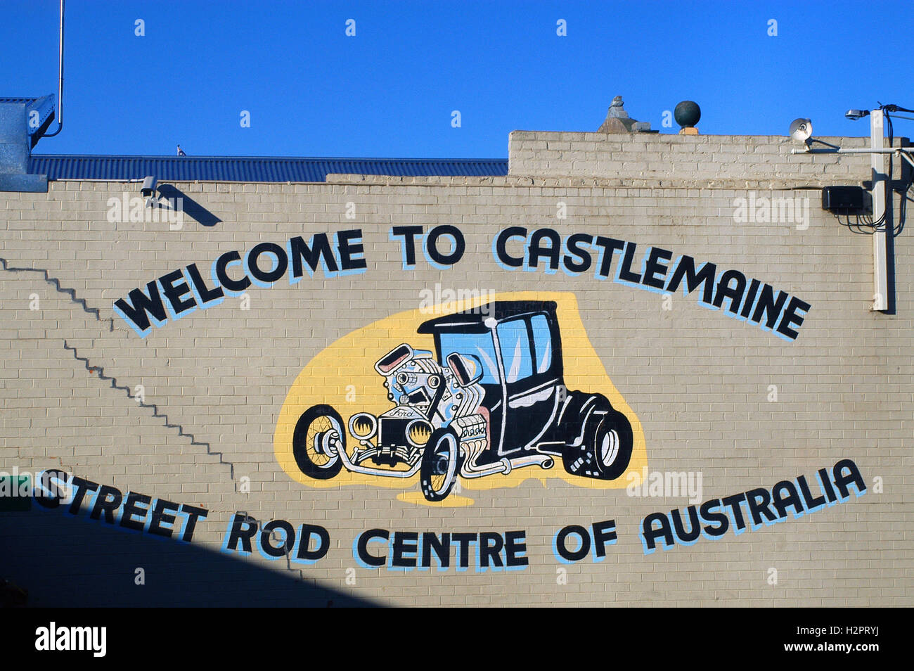 mural on a building representing a hot rod for Castlemaine in Australia is the capital of this specialty Stock Photo