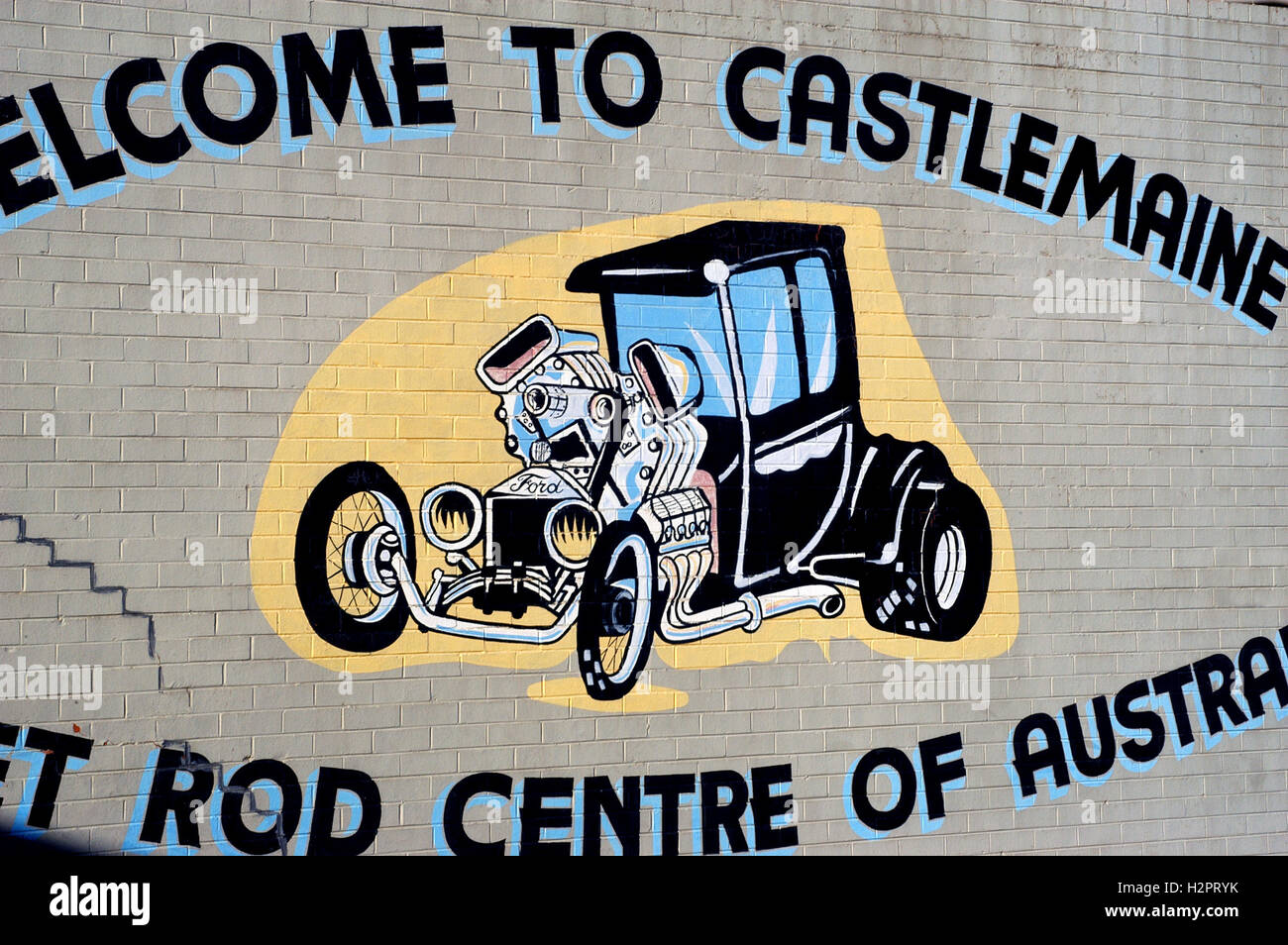 mural on a building representing a hot rod for Castlemaine in Australia is the capital of this specialty Stock Photo