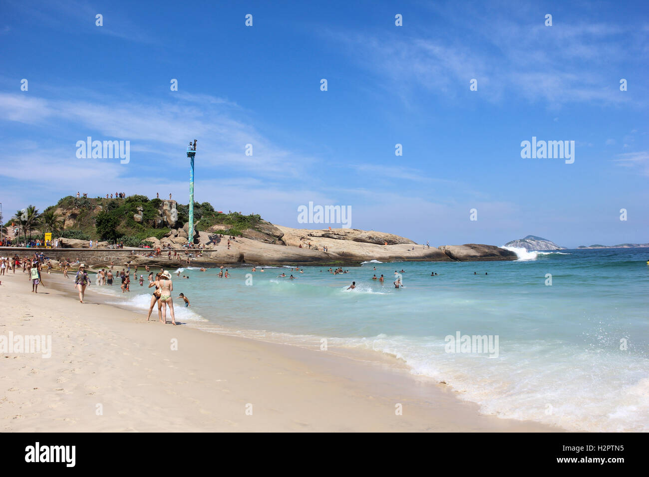 Arpoador beach in Rio de Janeiro in sunny summer day. Bathers enjoy the ...