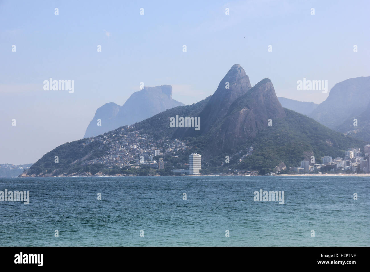 Two Brothers Mountain in Rio de Janeiro seen from the Ipanema Beach in sunny day. Stock Photo