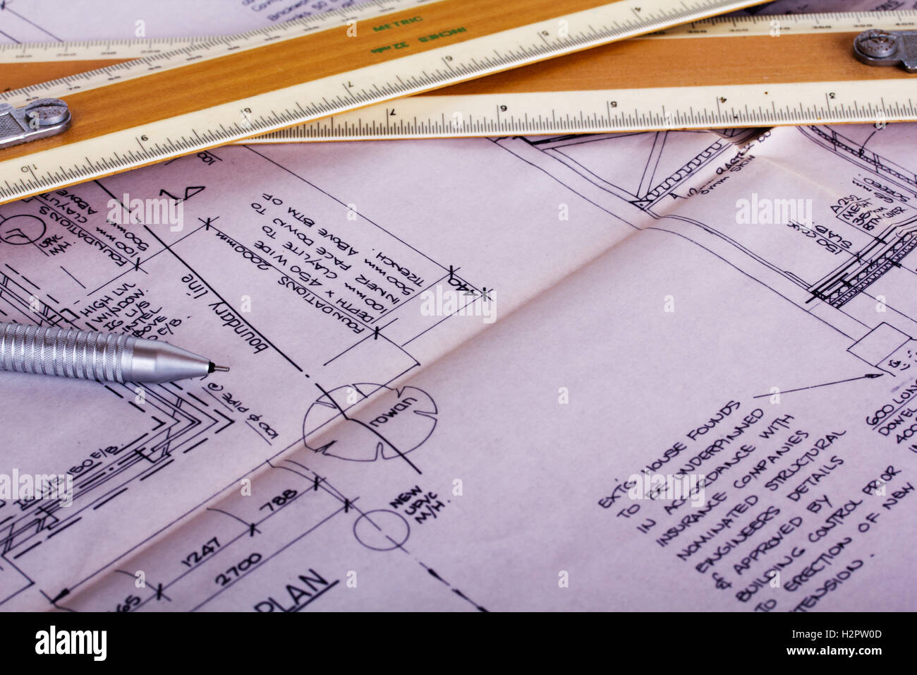 Drawing equipment on detailed architects house plans Stock Photo Alamy