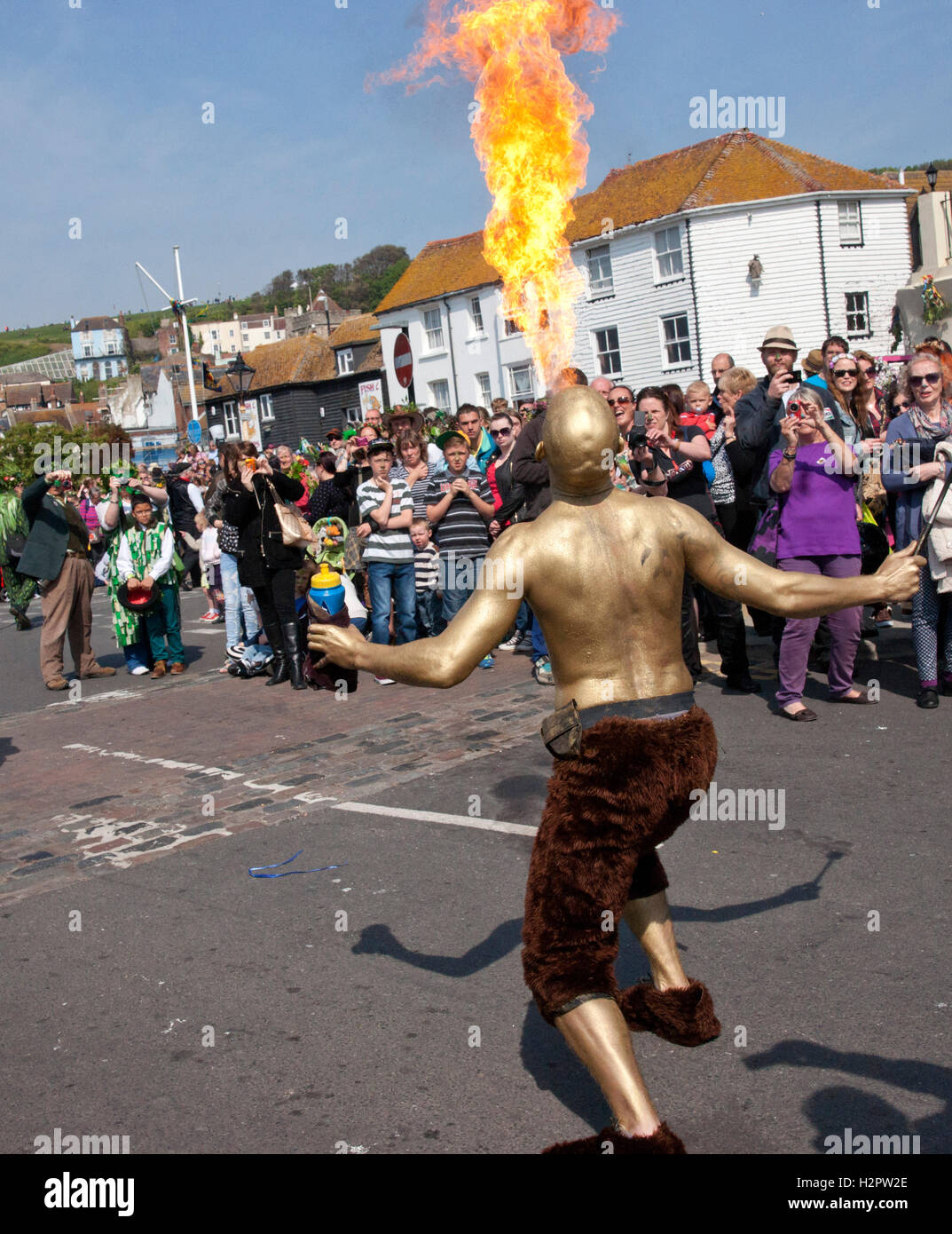 Fire eater at a May Day parade Stock Photo