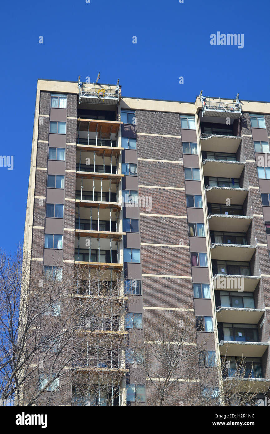 A condominium apartment building with re-construction of the balcony ...