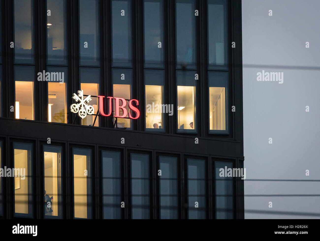 Early in the morning, the lights are switched on in some offices of a UBS bank office building at Zurich, Switzerland. Stock Photo
