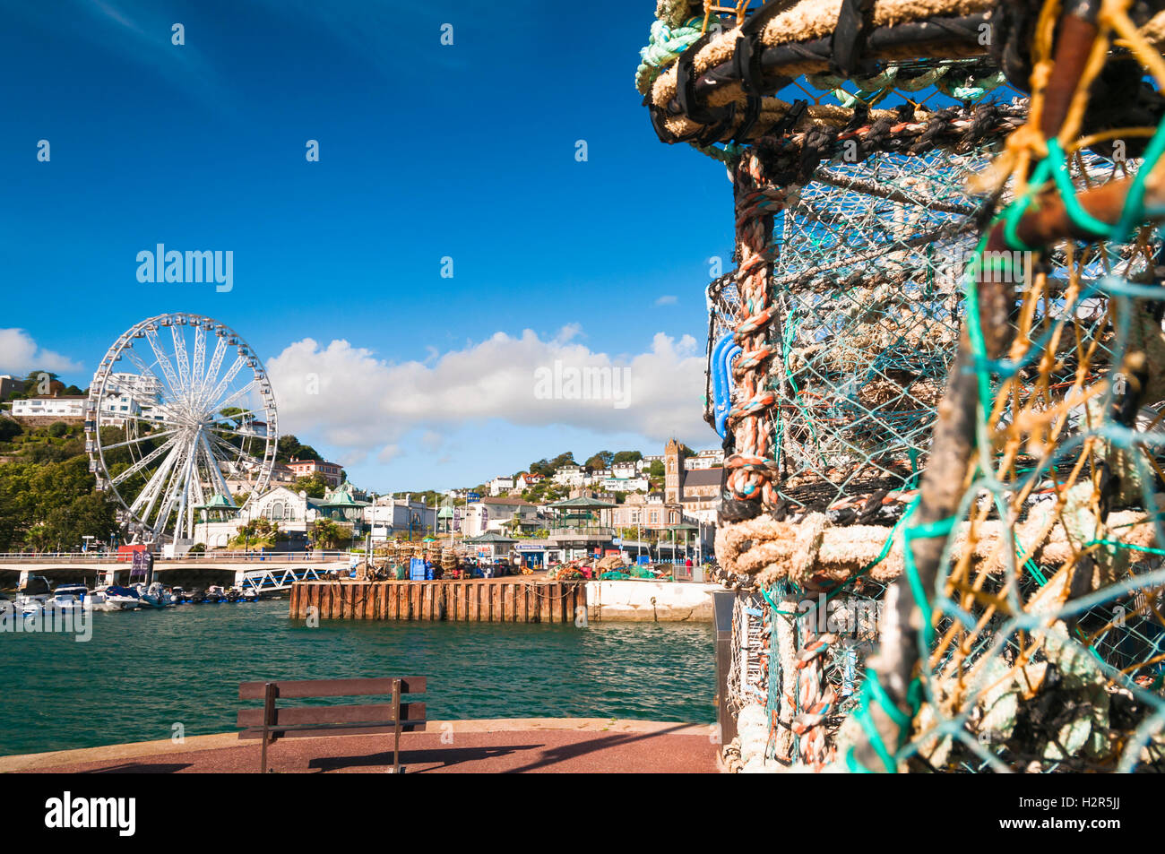 Lobster pots and the Torquay Wheel from the harbour Stock Photo Alamy