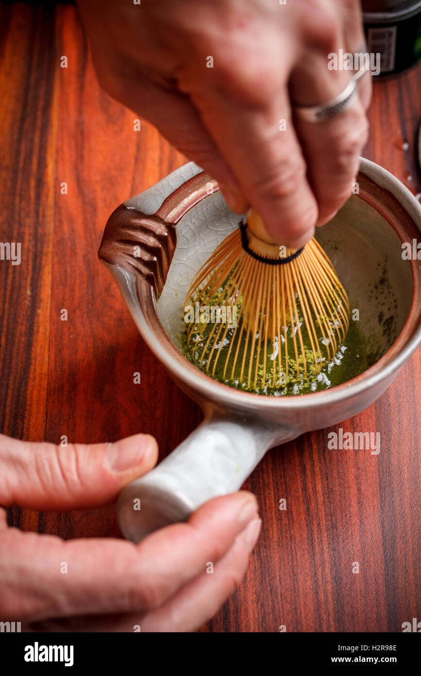 Stirring matcha tea Stock Photo