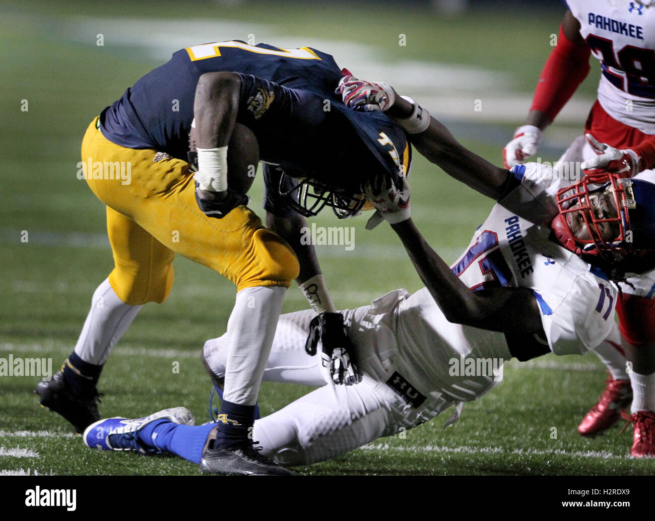 Florida, USA. 30th Sep, 2016. Pahokee's 17 Deonte Nelson tackles Boca's 2 Shelley Singletary