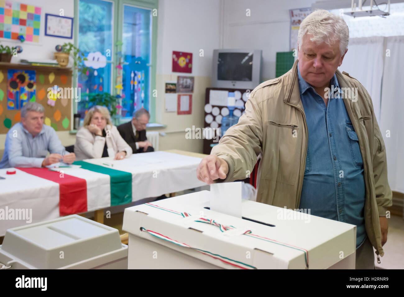 Budapest. 2nd Oct, 2016. A Hungarian casts vote during a referendum on EU migrant quotas at a polling station in Budapest Oct. 2, 2016. Polling stations across Hungary opened at 6 a.m. local time (0400 GMT) on Sunday for a government-sponsored anti-migrant referendum, initiated to counter an EU plan to distribute asylum seekers among its member states. Credit:  Attila Volgyi/Xinhua/Alamy Live News Stock Photo