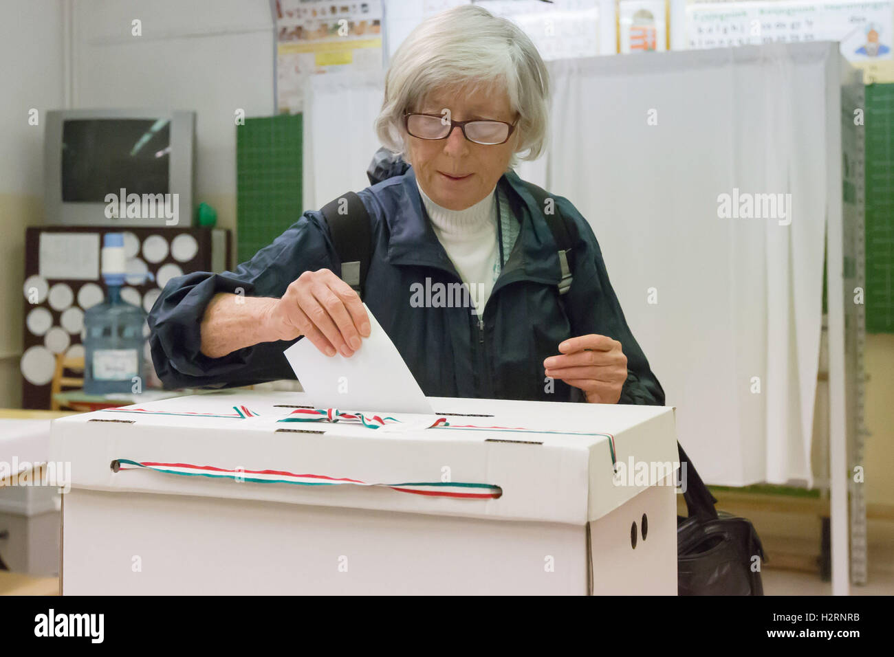 Budapest. 2nd Oct, 2016. A Hungarian casts vote during a referendum on EU migrant quotas at a polling station in Budapest Oct. 2, 2016. Polling stations across Hungary opened at 6 a.m. local time (0400 GMT) on Sunday for a government-sponsored anti-migrant referendum, initiated to counter an EU plan to distribute asylum seekers among its member states. Credit:  Attila Volgyi/Xinhua/Alamy Live News Stock Photo
