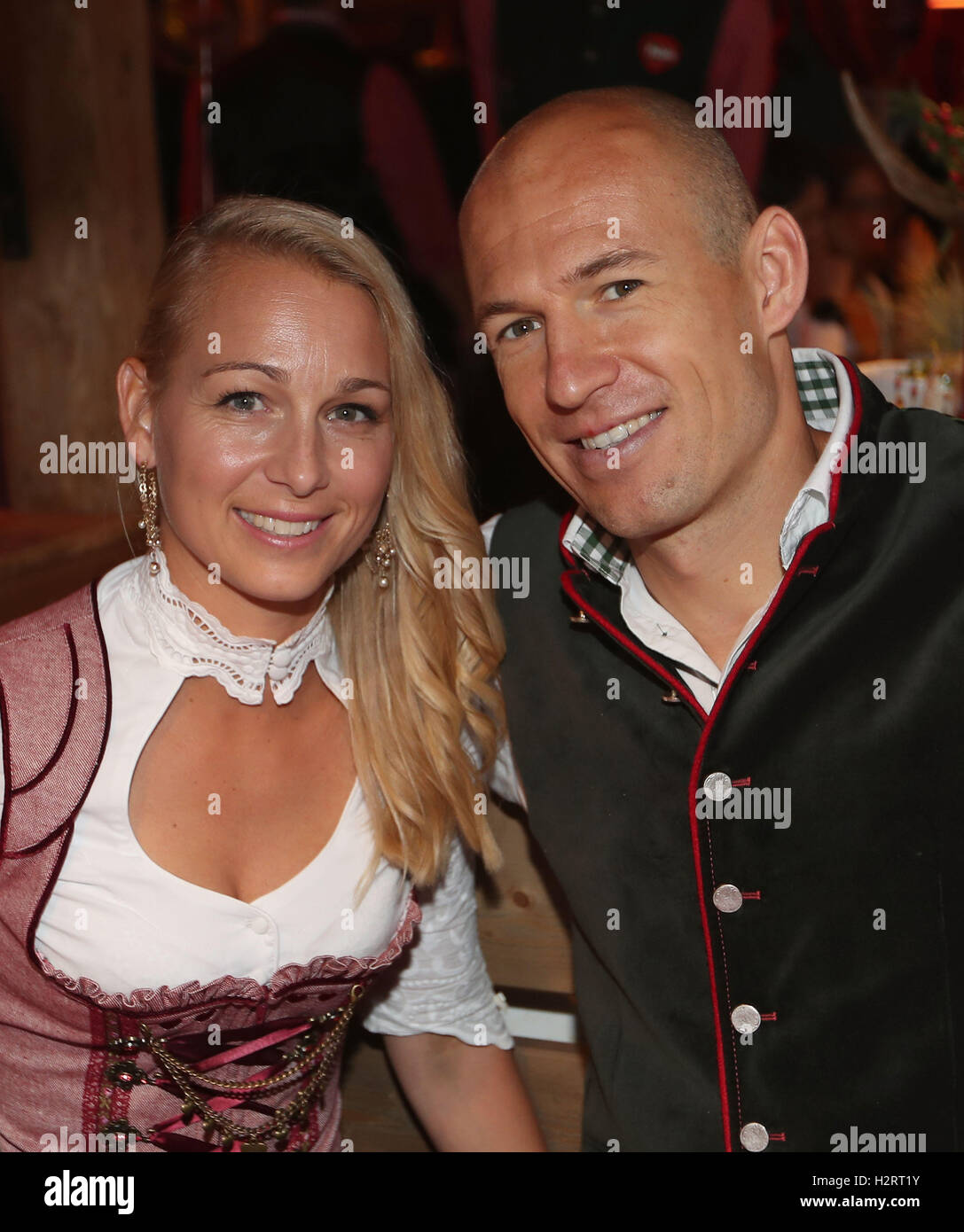 Munich, Germany. 2nd Oct, 2016. HANDOUT - A handout picture made available on 02 October 2016 by Getty Images shows Arjen Robben of FC Bayern Muenchen and his wife Bernadien Eillert attending the Oktoberfest beer festival at Kaefer Wiesenschaenke tent at Theresienwiese on October 2, 2016 in Munich, Germany. Photo: Alexander Hassenstein/Bongarts/Getty Images/dpa (ATTENTION EDITORS - Editorial use only in connection with current reporting and mandatory source credit: Alexander Hassenstein/Bongarts/Getty Images/dpa)/dpa/Alamy Live News Stock Photo