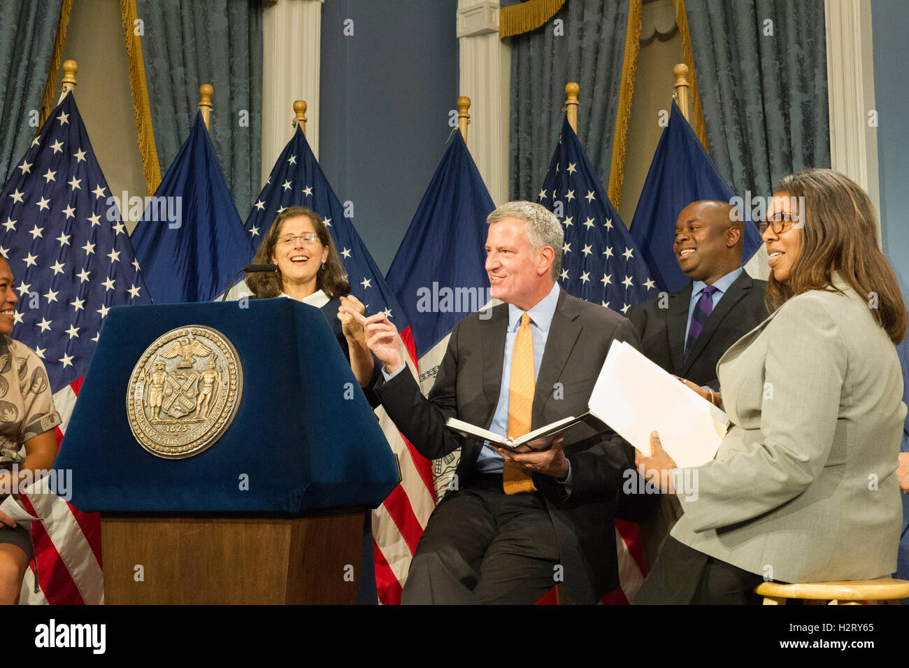New York Mayor Bill de Blasio, center, at a bill signing related to increasing accountability and access for the New York's  Minority and Women owned Business Enterprise program on Wednesday, September 28, 2016 in New York. (© Frances M. Roberts) Stock Photo
