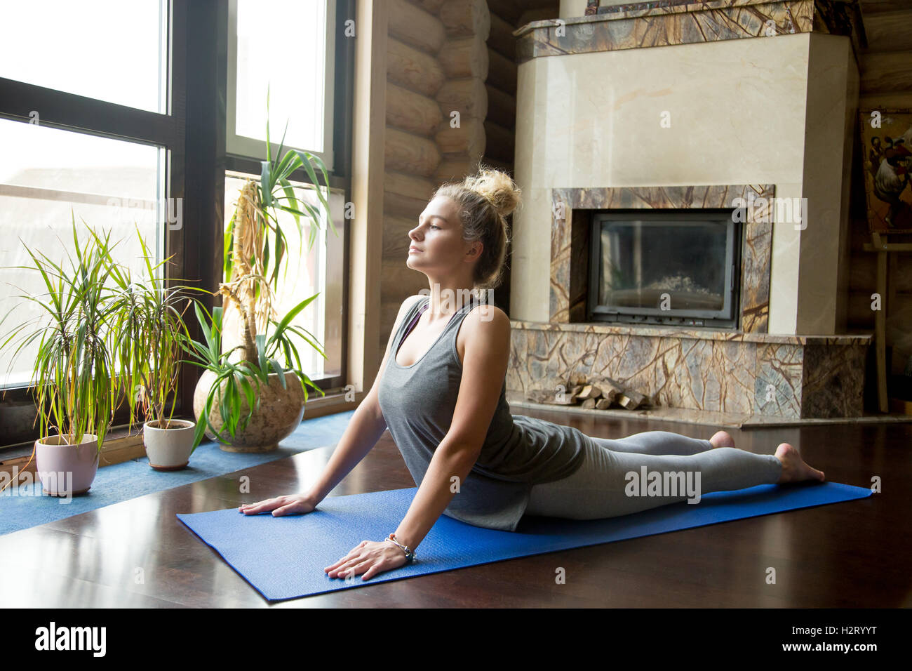 Yoga at home: Cobra Pose Stock Photo