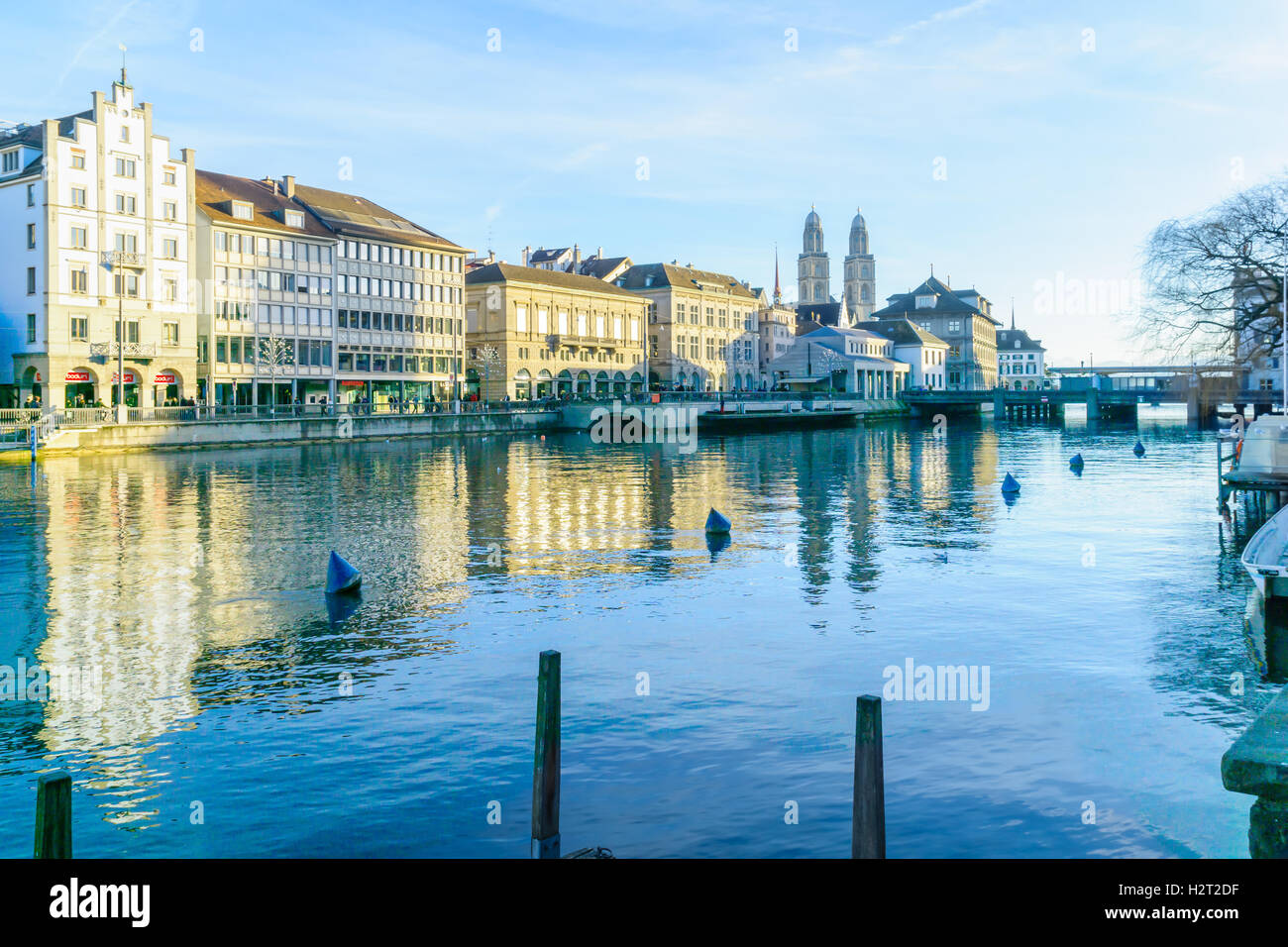 ZURICH, SWITZERLAND - DECEMBER 25, 2015: View of the Old Town (Altstadt) and the Limmat River, with the Grossmunster (great mins Stock Photo