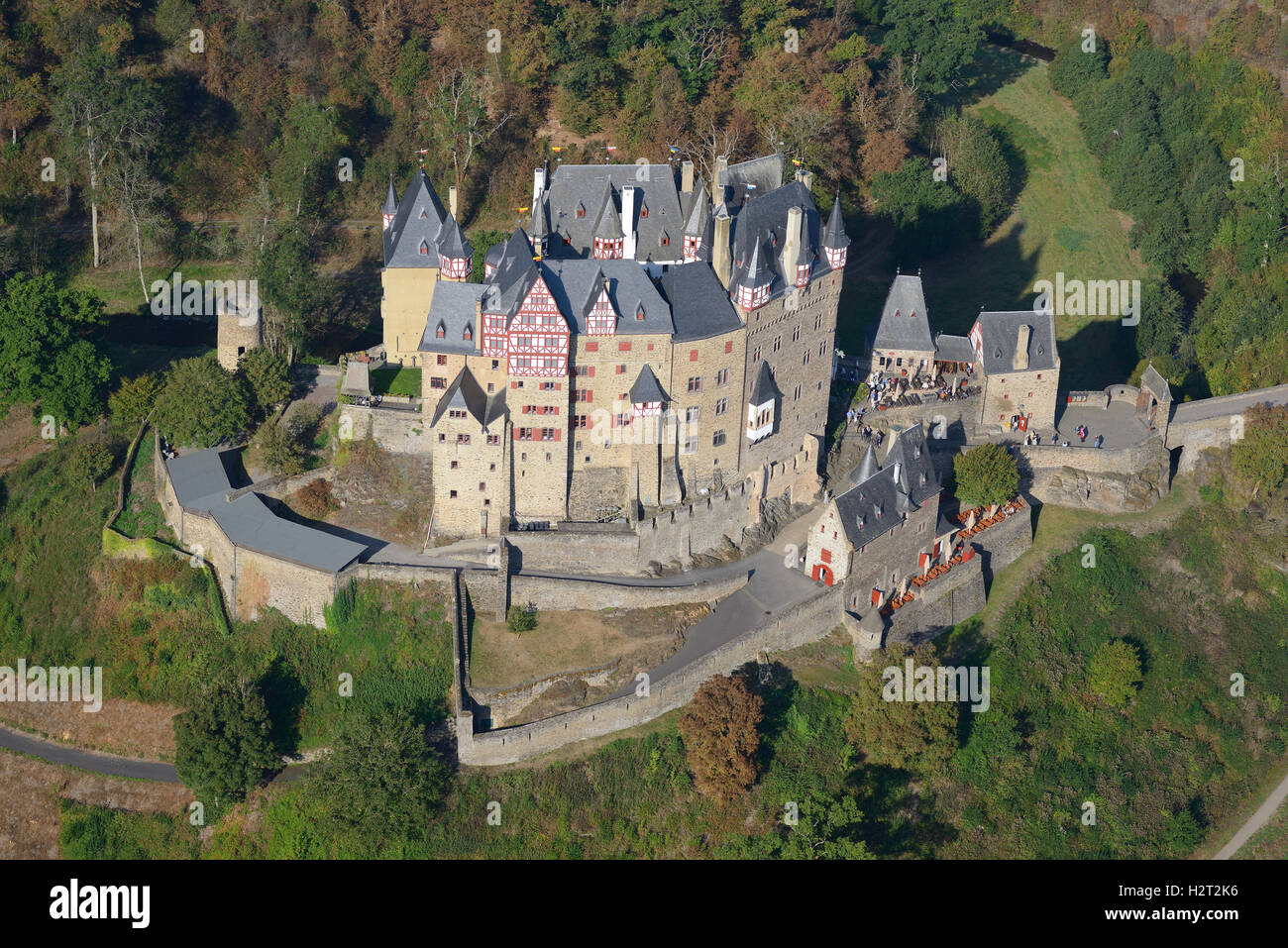 AERIAL VIEW. Medieval castle in a wooded environment. Elz Castle, Wierschem, Rhineland-Palatinate, Germany. Stock Photo