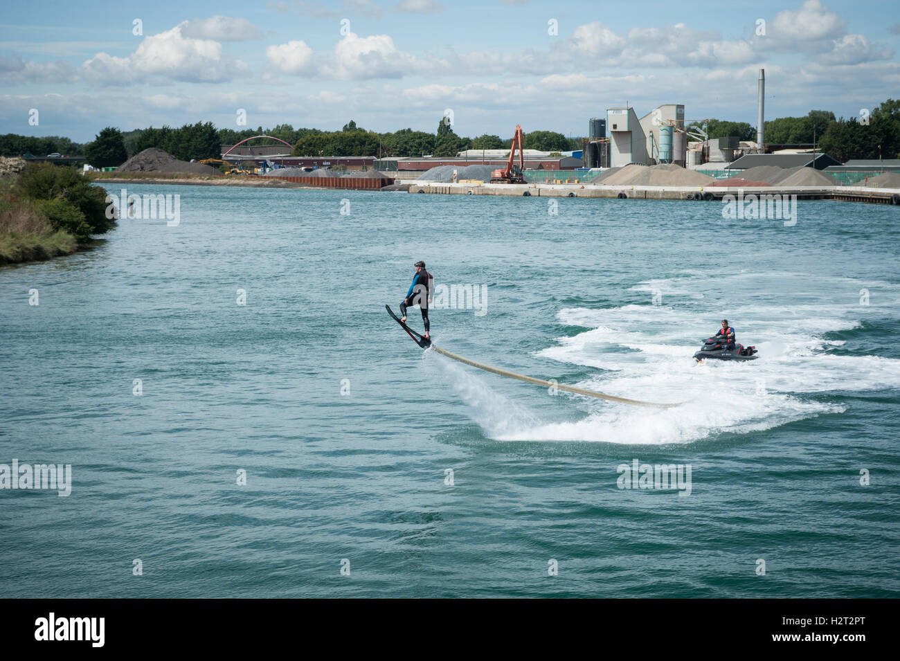 A flyboarder is thrust into the air by a jet of high pressure water